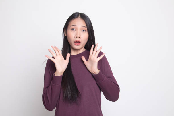 istock Shocked young Asian woman. 1134889958