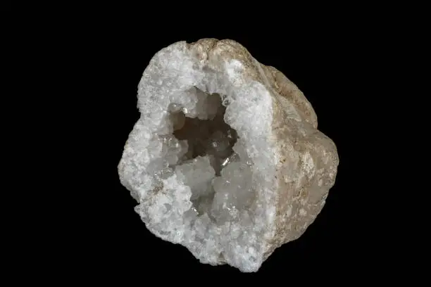 Macro mineral stone Quartz geode black background close up