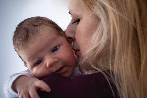 istock Newborn baby boy with mother 1134894718