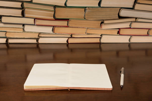 istock notebook and pen on the background of books 1134900088