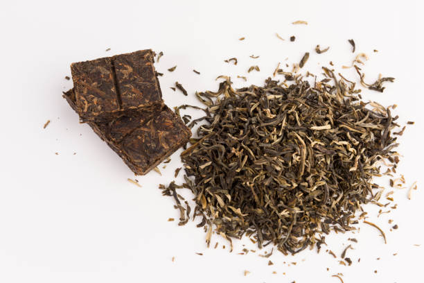 istock green tea isolated on white background, top view 1134900152