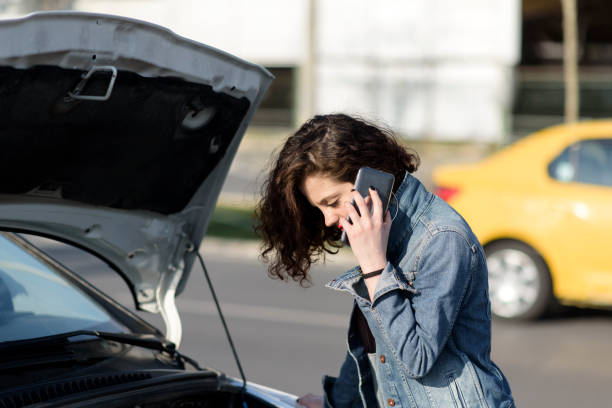istock Unhappy woman with a broken car 1134901337