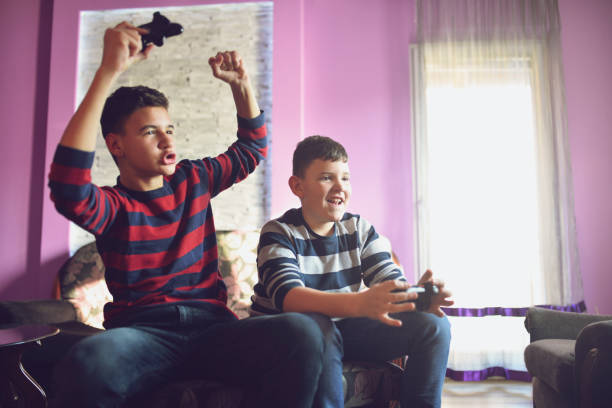 istock Celebrating winning the first place in a video game 1134901388
