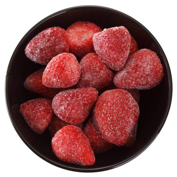 istock Frozen strawberry berries in a cup. Isolated on white background. View from above. 1134904251
