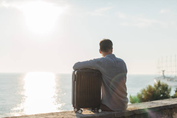 istock Tourist man by the sea 1134907094