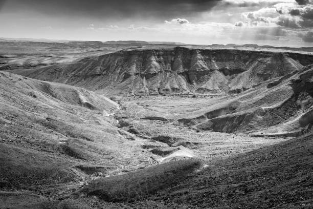 Desert mountains ridge range cliffs scenic dry stream valley view black and white monochrome landscape, travel destination nature  Negev Israel.