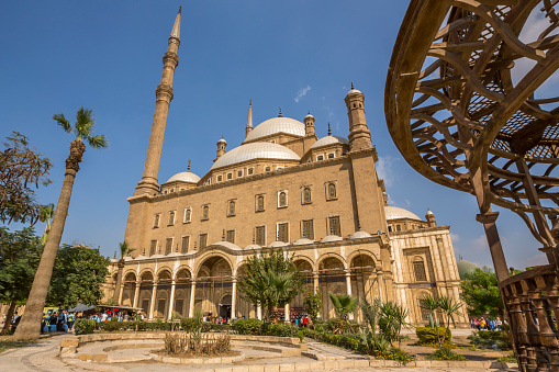 Cairo, Egypt - November 5, 2018: The Ottoman Alabaster Mosque situated on the summit of the Saladin Citadel, there are always many tourists and locals here, Cairo.  This mosque, along with the citadel, is one of the landmarks and tourist attractions of Cairo and is one of the first features to be seen when approaching the city any direction.