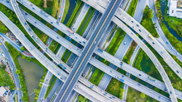 Traffic trails on highway intersection stock photo
