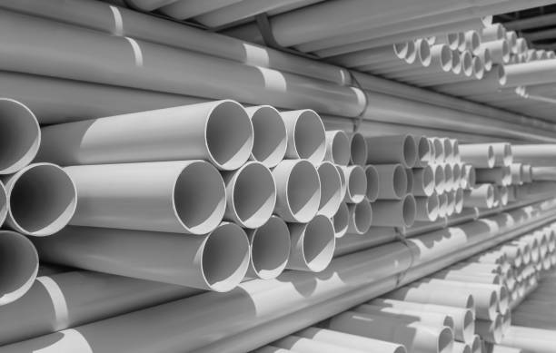 PVC pipe stacked in warehouse PVC pipe stacked in warehouse pipe tube stock pictures, royalty-free photos & images