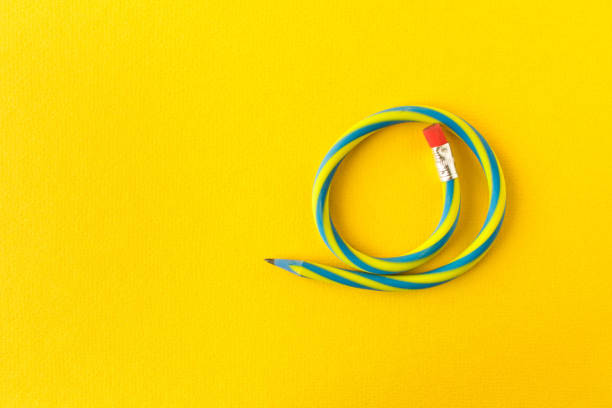 istock Flexible pencil . Isolated on yellow background. Bending pencil. 1134914600
