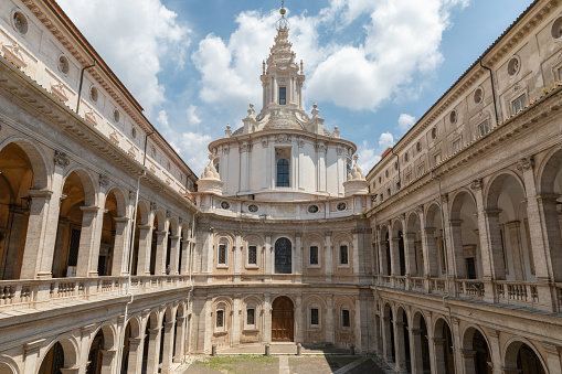 Rome, Italy - June 21, 2018: Panoramic view of exterior of Sant'Ivo alla Sapienza. It is a Roman Catholic church in Rome. Built in 1642-1660 by the architect Francesco Borromini