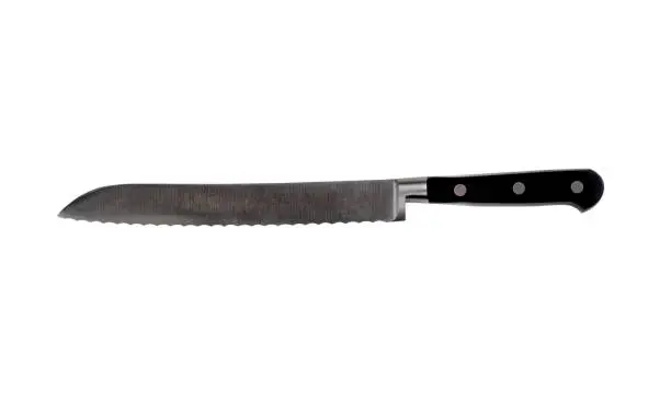 Large serrated steel kitchen knife isolated on a white background