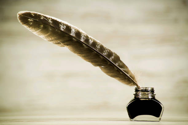 istock Writing concept, pen and inkwell on a light background 1134921116