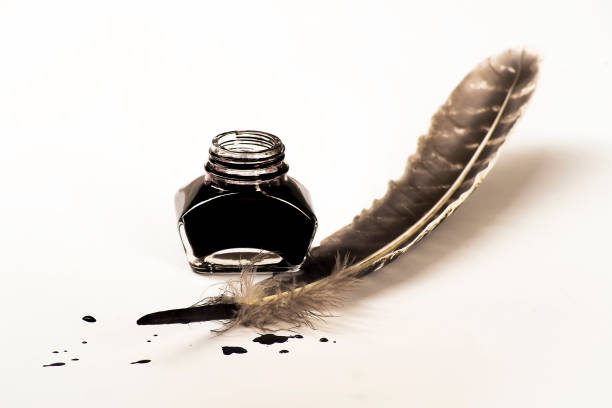 istock Writing concept, pen and inkwell on a white background 1134921137