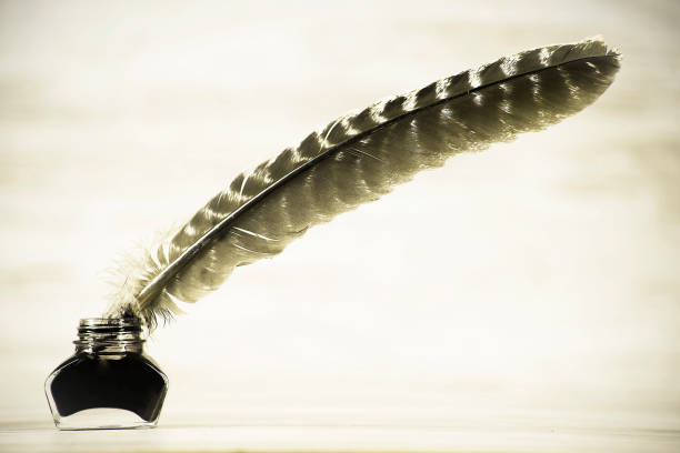 istock Writing concept, pen and inkwell on a white background 1134921239