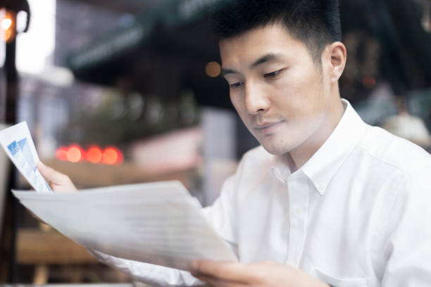 istock asian business man working with report 1134924648
