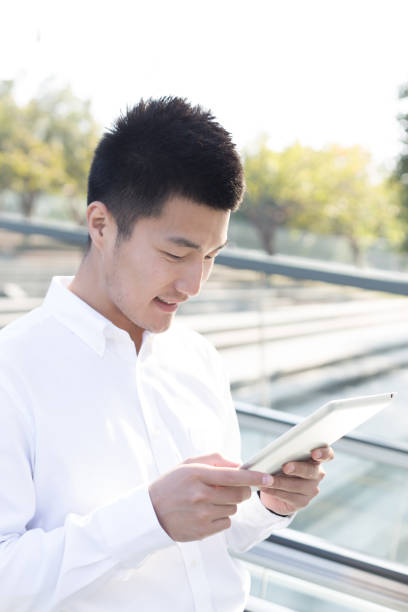 istock asian businessman with mobile phone 1134924879