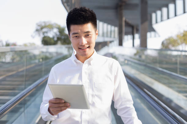 istock businessman holding digital tablet 1134924881