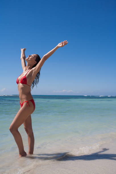 istock woman on a beautiful beach 1134925753