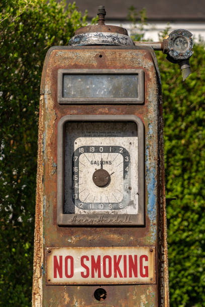 Disused vintage fuel pump left to decay. A sign of the future without fossil fuels moving to an electric and renewable energy source powered vehicles