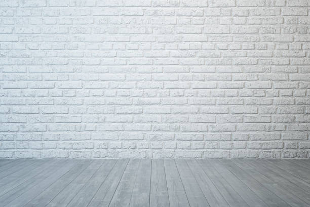 istock empty room with brick wall and concrete floor 1134927069