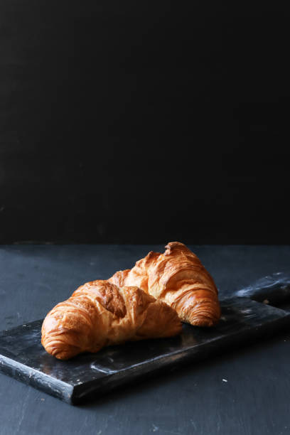 istock Croissant on a black background 1134927272