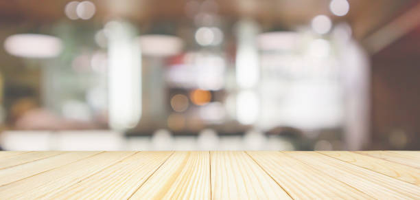 istock Wood table top with Cafe Restaurant interior with bar counter blur abstract background with bokeh light 1134928398