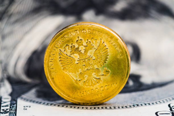 istock 10 roubles against 100 dollars background 1134931306