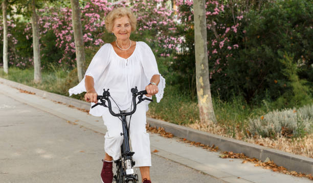 istock Mature woman cycling 1134931383