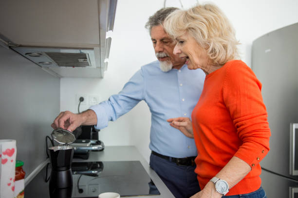 istock Senior couple making coffee at home 1134933273