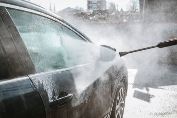 istock Man washing his car with high-pressure washing 1134933528