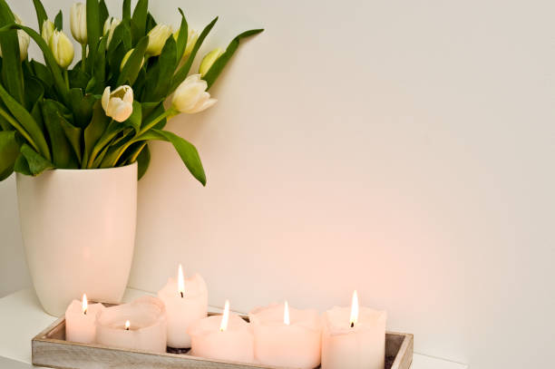 istock Lit candles on shelf home decor 1134933730