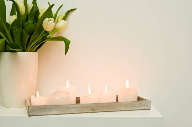 istock Lit candles on shelf home decor 1134934457