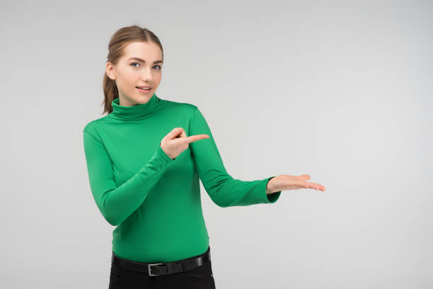 Young girl stands in surprise points out