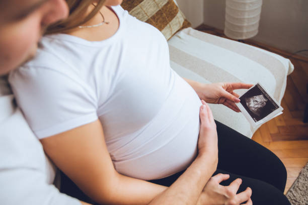 istock Happy couple watching ultrasound picture 1134937215