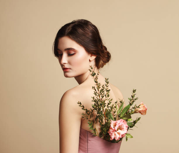 istock Young beautiful girl and flowers 1134938103