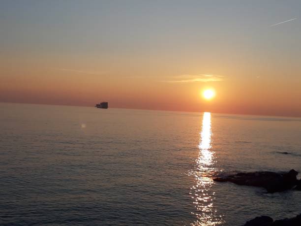 istock Sunset, sea and blue sky 1134938779