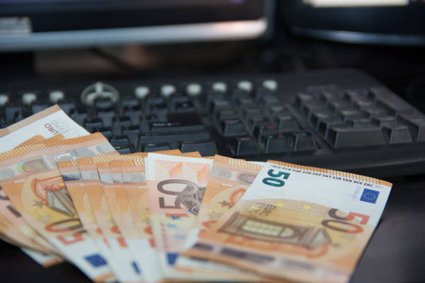 istock euro money with computer keyboard on the table 1134939804