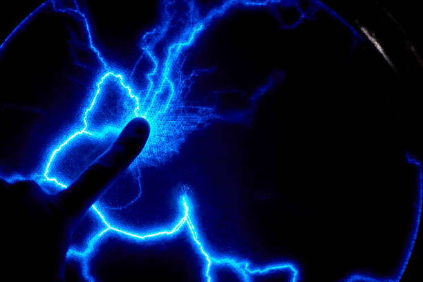 istock Finger touch electric plasma ball on a dark background. Static electricity model 1134940231