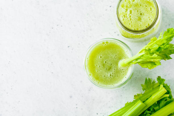 istock Green detox celery juice in a glass. 1134940791