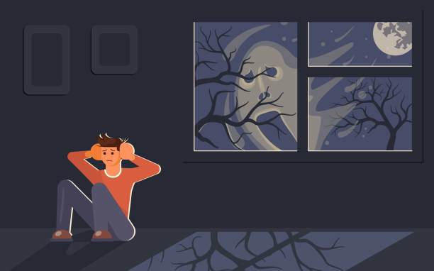 istock Scared young man sitting on floor and hiding from frightening blurry face outside 1134940815