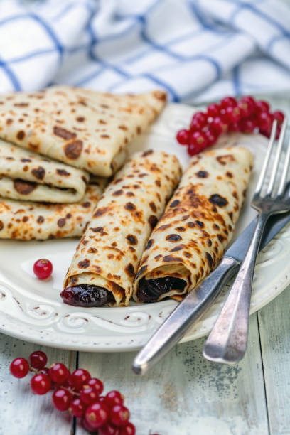 istock Norwegian pancakes stuffed with berry jam. 1134941417