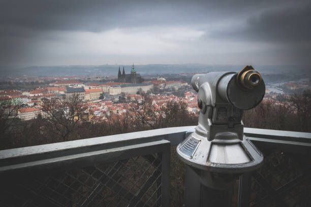 Prague landscape photography with Prague castle and tourist telescope in cloudy day