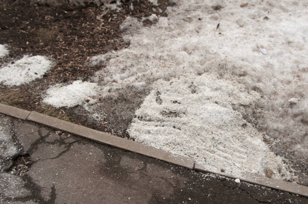 istock Deicing chemicals on asphalt road 1134945762
