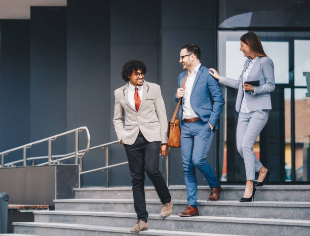 istock Happy business people walking outdoors and communicating. 1134945925