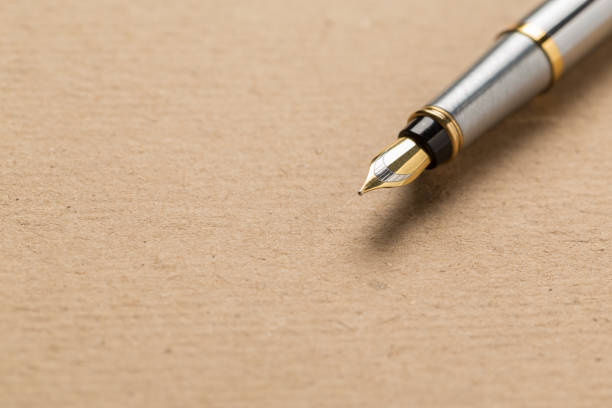 istock fountain pen on old paper. Vintage 1134947787