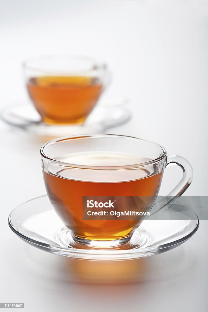 two cups of tea over white background  Tea - Hot Drink Stock Photo