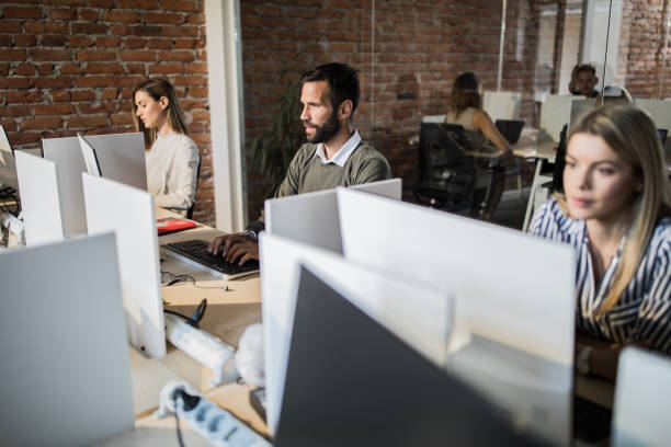 istock Young businessman typing an e-mail on laptop in the office. 1134950704