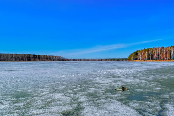 istock early spring, ice melts on the lake 1134950917