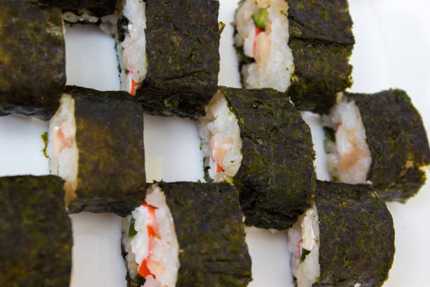 Japanese cuisine, rice sushi and fish - closeup, vegetarian dish